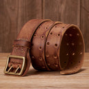 Brown leather belt with brass buckle on a wooden surface, Obroi