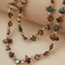 Necklace with multicolored beads on a beige background, Obroi