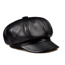 Black leather cap on a white background, Obroi