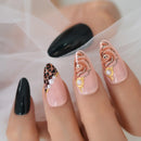 Close-up of a hand with intricately designed nails featuring leopard print, floral patterns, and pearls ,Obroi