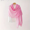 Pink scarf draped over a mannequin on a white background, Obroi