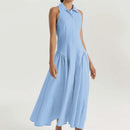 A sleeveless light blue midi dress with a high collar and a flared skirt, shown on a model against a plain light background. The brand logo 'Obroi' is visible in the top-left corner.