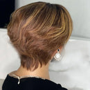Back view of a person with short, styled hair wearing earrings and a necklace, Obroi