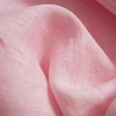Close-up of soft pink fabric with a subtle texture, Obroi
