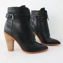 Black leather ankle boots with wooden heel on a white background, branded 'Obroi'.
