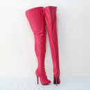 Red high-heeled boots with studded details on a white background, Obroi