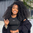 Woman wearing a black crop top with 'Mesh' branding outdoors, Obroi