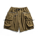 Brown cargo shorts with multiple pockets on a white background, Obroi