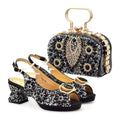 Black and gold shoes and handbag set on a white background, Obroi