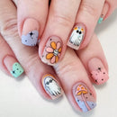 Nails with cartoon-themed designs on a light background, Obroi
