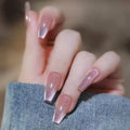 Close-up of a hand with pink glittery nail polish on a blurred background, Obroi