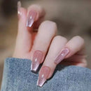 Close-up of a hand with pink glittery nail polish on a blurred background, Obroi