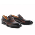 Pair of black and brown patterned dress shoes on a white background, Obroi
