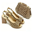 A matching women's evening wear set featuring a pair of open-toe high-heeled slingback sandals and a structured clutch handbag, both in a metallic gold tone with extensive rhinestone embellishments, Obroi