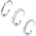 Three silver open rings with different designs on a white background, Obroi