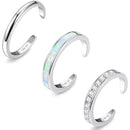 Three silver open rings with different designs on a white background, Obroi