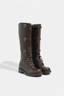 Pair of brown leather knee-high boots with buckles on a white background, Obroi