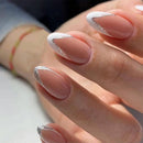 Close-up of a hand with white nail polish and silver glitter on a neutral background, Obroi