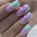 Nails with pastel pink and green design featuring flowers and a moon, Obroi