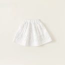 White skirt with floral embroidery on a beige background, Obroi