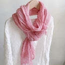 Pink scarf draped over a mannequin against a white background, Obroi