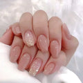 Hand with pink nail polish and glitter accents on a white background, Obroi