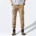 Person wearing beige cargo pants on a white background, Obroi