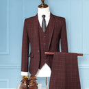 Red plaid suit on a mannequin against a light blue wall, Obroi