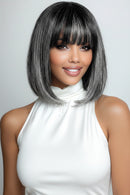 Woman with a stylish haircut against a plain background, Obroi