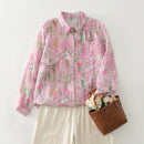 Pink floral shirt with a brown bag and flowers on a white background, Obroi