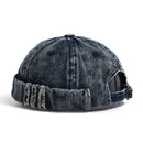 Denim cap with distressed details on a white background, Obroi