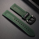 Green leather watch strap with black buckle on a dark gray background ,Obroi