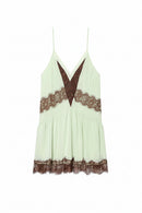 Light green dress with brown lace details on a white background, Obroi