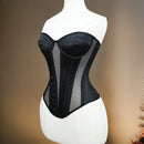 Black corset on a mannequin against a neutral background, Obroi