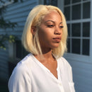 Woman with blonde hair wearing a white shirt outdoors, Obroi