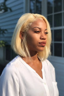 Woman with blonde hair wearing a white shirt outdoors, Obroi