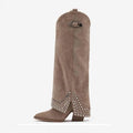 Brown boot with decorative studs on a white background, Obroi