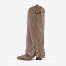 Brown boot with decorative studs on a white background, Obroi