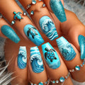 Nails with blue wave and turtle design, paired with turquoise jewelry, Obroi