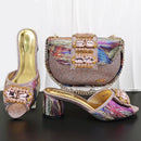 Colorful shoes and handbag set with decorative elements on a dark surface, Obroi
