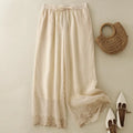 Beige pants with lace trim, a woven handbag, and white shoes on a light background, Obroi