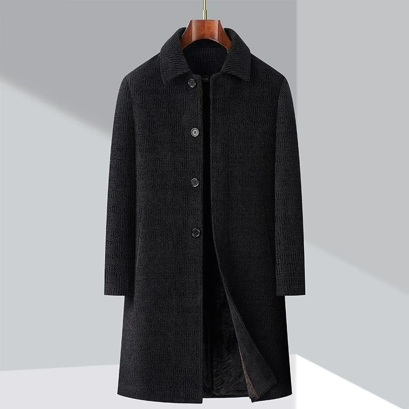 Black coat on a hanger with Obroi branding in the corner.