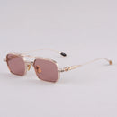 Sunglasses with gold frame and pink lenses on a light gray background, Obroi