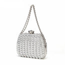 Silver clutch bag with chain strap on a white background, brand 'Obroi' visible.
