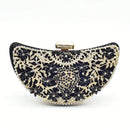 Black and gold floral patterned clutch bag on a white background, Obroi