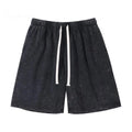 Black shorts with a white drawstring on a white background, Obroi
