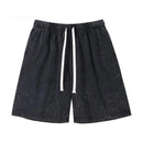 Black shorts with a white drawstring on a white background, Obroi
