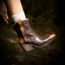 Brown leather ankle boots worn with white socks against a blurred natural background, Obroi
