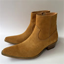 Pair of brown suede boots on a white background, Obroi