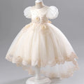 Ivory flower girl dress on a mannequin against a gray background, Obroi